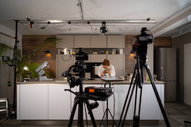 tv set studio kitchen female cook preparing cookies - food stock pictures, royalty-free photos & images