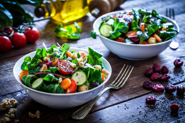 two fresh salad bowls - food stock pictures, royalty-free photos & images