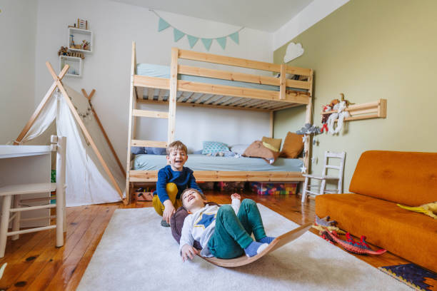 two little boys playing in their room - home decoration stock pictures, royalty-free photos & images