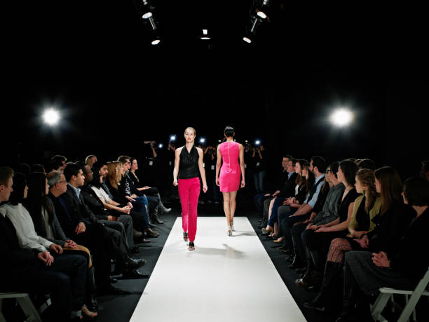 two models on catwalk during fashion show - fashion week stock pictures, royalty-free photos & images