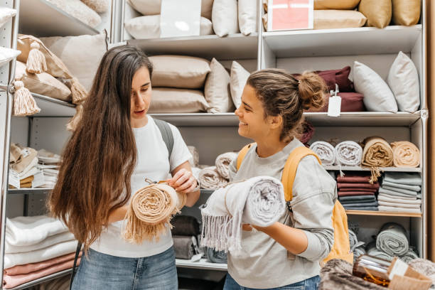 two young women on a shopping spree in a household store. - home decoration stock pictures, royalty-free photos & images