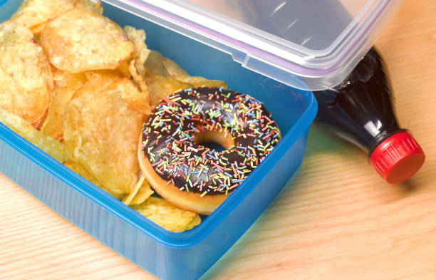 unhealthy lunch box - junk food stock pictures, royalty-free photos & images