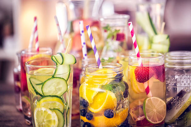 variation of infused water with fresh fruits - food stock pictures, royalty-free photos & images