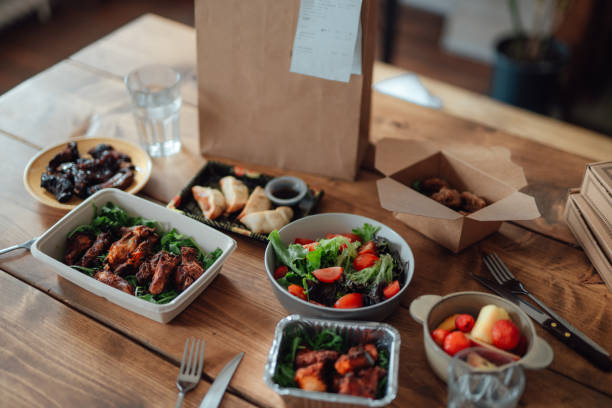variation of takeaway meal on the table - junk food stock pictures, royalty-free photos & images