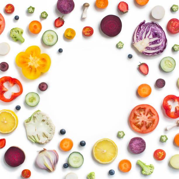 various sliced fruits and vegetables on white background. - food stock pictures, royalty-free photos & images