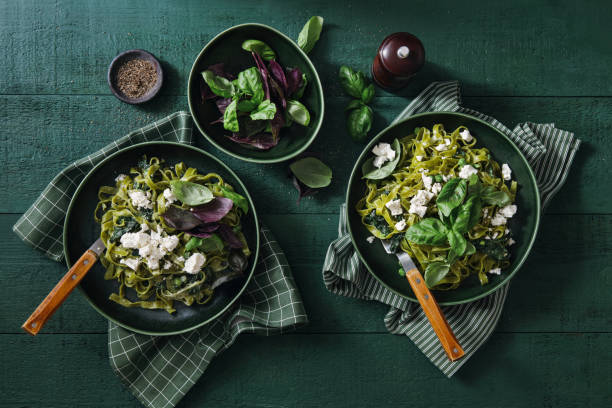 vegan gluten-free creamy spinach pasta - food stock pictures, royalty-free photos & images