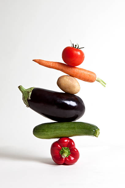 vegetables arranged in a stack - food stock pictures, royalty-free photos & images