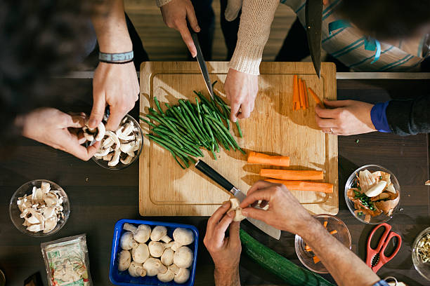 vegetables being cut in cooking class - food stock pictures, royalty-free photos & images