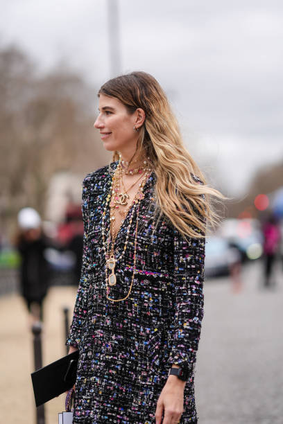 Veronika Heilbrunner wears a tweed colored jacket, Chanel necklaces, outside Chanel, during the Womenswear Fall/Winter 2024/2025 as part of Paris...
