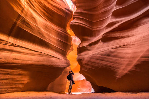view down canyon walls to photographer - travel stock-fotos und bilder