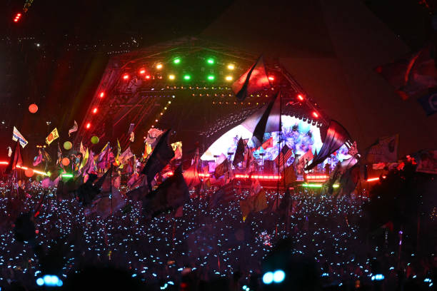 View from the crowd as Coldplay perform on the Pyramid Stage on the fourth day of the Glastonbury festival at Worthy Farm in the village of Pilton in...