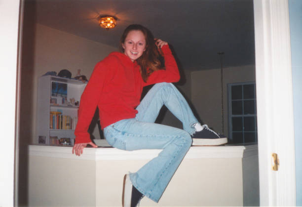 vintage 1990s teenager with 90s style, y2k style, flared jeans and platform sneakers - fashion stock pictures, royalty-free photos & images