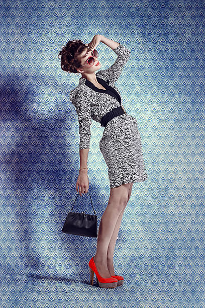 vintage style photo of a lady in designer clothes - fashion stock pictures, royalty-free photos & images