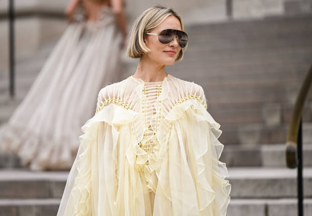 Violet Grace is seen wearing a yellow ruffled sheer Zimmermann dress with Chloe sunglasses outside the Zimmermann show during the Womenswear...