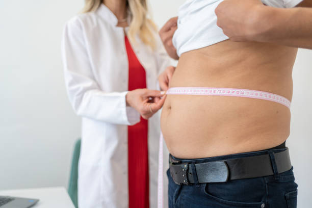 waist measurement - junk food stock pictures, royalty-free photos & images