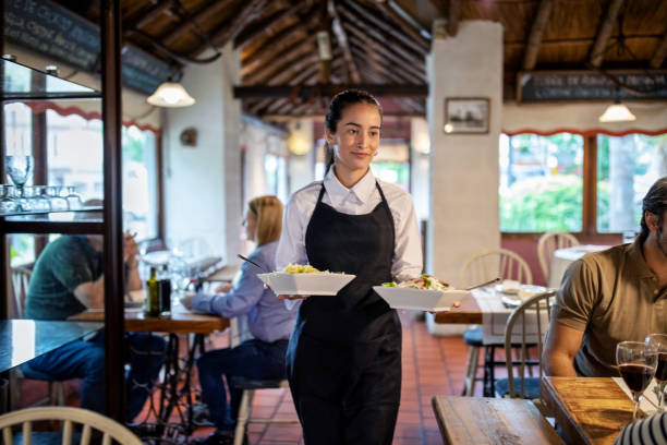 waitress serving food at restaurant - food stock pictures, royalty-free photos & images