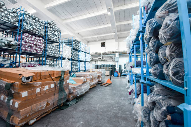 warehouse in textile factory stuffed with many materials - fashion stock pictures, royalty-free photos & images