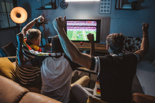 watching soccer championship at home - home decoration stock pictures, royalty-free photos & images