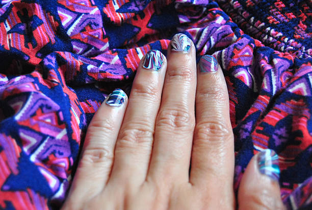 water marble nail art on fingernails - nails art stock pictures, royalty-free photos & images