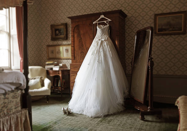 wedding dress in hotel room - home decoration stockfoto's en -beelden