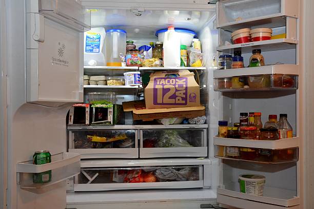 What's in the fridge. Refrigerator filled with both healthy and junk food.