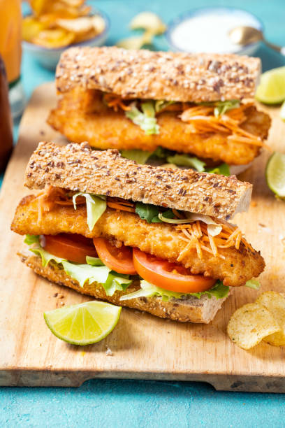 wholegrain bread with fish cake - junk food stock pictures, royalty-free photos & images
