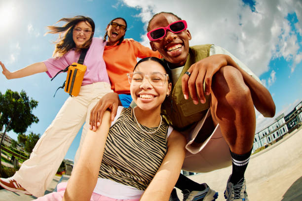 wide angle shot of gen z group of friends hanging out together. - fashion stock pictures, royalty-free photos & images