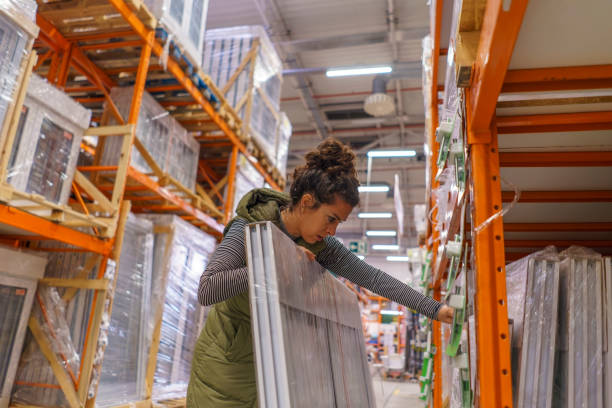 woman buying materials to renovate her house - home decoration stock pictures, royalty-free photos & images