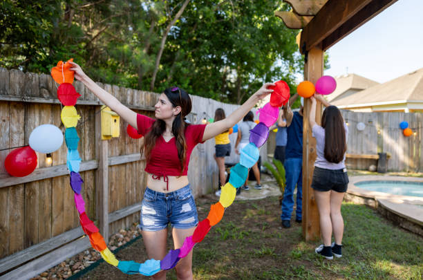 woman decorating the garden for a mexican party - garden decoration stock pictures, royalty-free photos & images