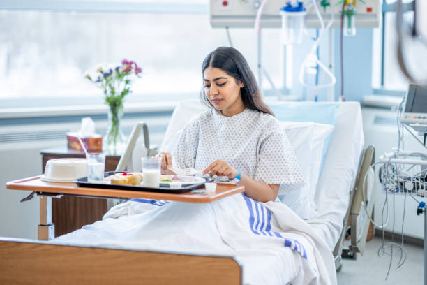 woman eating in the hospital - food stock pictures, royalty-free photos & images