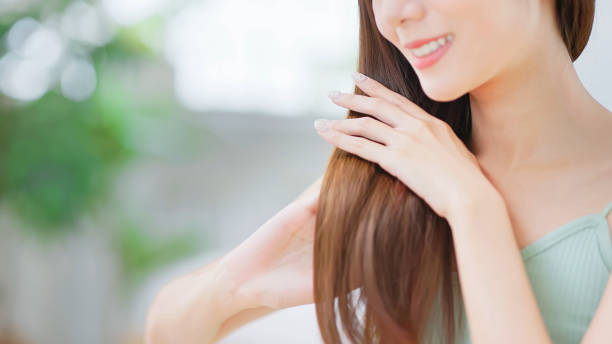 woman has hair care - hairstyle stock pictures, royalty-free photos & images