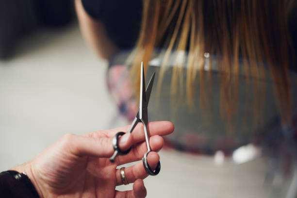 woman has home hair cut - hairstyle fotografías e imágenes de stock