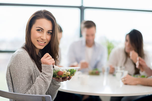 woman having dinner with friends - junk food stock pictures, royalty-free photos & images