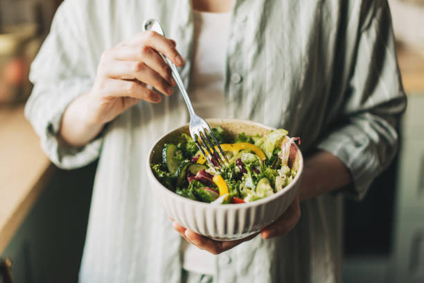 woman holding bowl with products for heart-healthy diet, closeup - food stock pictures, royalty-free photos & images