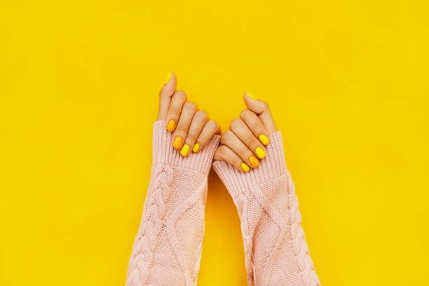 woman in sweater with colorful manicure. trending bright backdrop of the year. perfect nails concept - nails art stock pictures, royalty-free photos & images