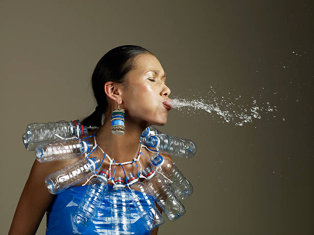 woman in water outift spitting - fashion stock pictures, royalty-free photos & images