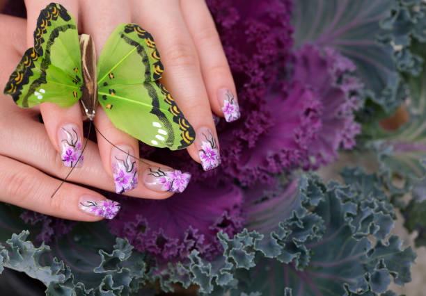 woman manicure and butterfly - nails art stock pictures, royalty-free photos & images