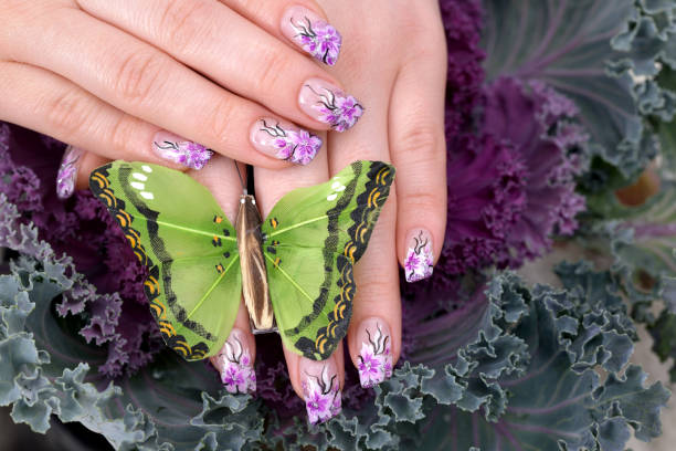 woman manicure posed with green butterfly - nails art stock pictures, royalty-free photos & images