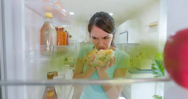 woman open refrigerator - food stock pictures, royalty-free photos & images