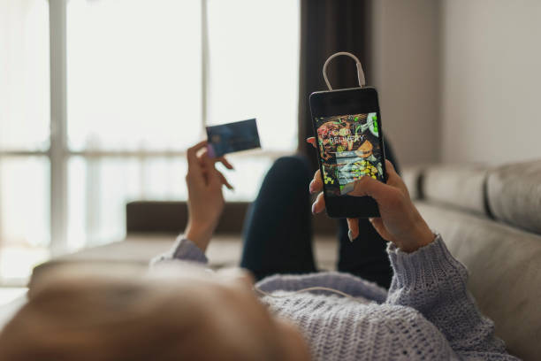 woman orders food for home - junk food stock pictures, royalty-free photos & images