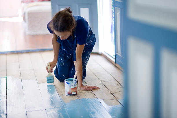 woman painting wooden floor - home decoration stock pictures, royalty-free photos & images
