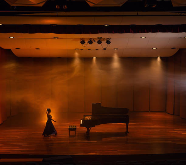 woman pianist preparing her recital in the concert hall - concert stock pictures, royalty-free photos & images