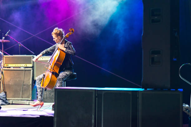 woman playing cello on the live concert - concert stock pictures, royalty-free photos & images