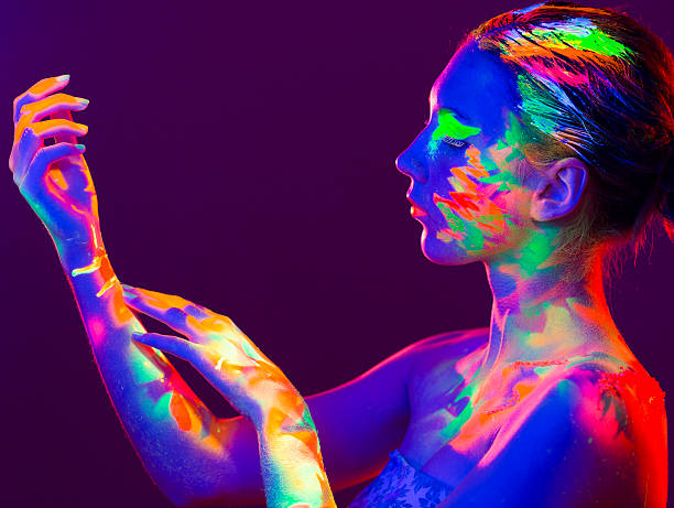 woman portrait painted with uv makeup color - nails art stock pictures, royalty-free photos & images