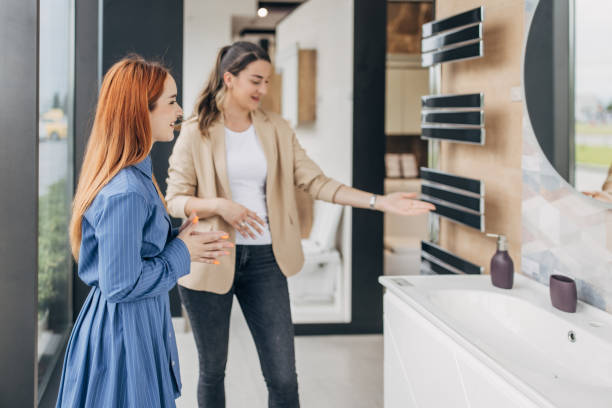 woman shopping for new bathroom - home decoration stock pictures, royalty-free photos & images
