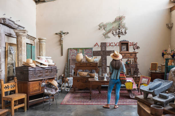 woman shopping in antique store - home decoration stock pictures, royalty-free photos & images