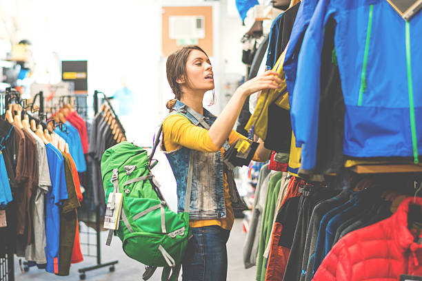 woman shopping in outdoor equipment mega store - fashion stock pictures, royalty-free photos & images