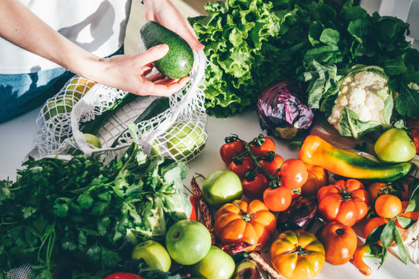 woman takes fresh organic vegetables - food stock pictures, royalty-free photos & images