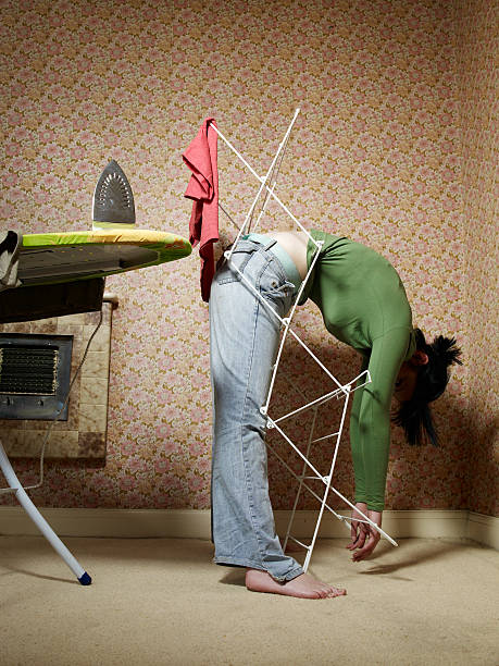 woman trapped in airer - home decoration stock pictures, royalty-free photos & images