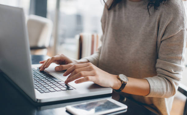woman using her laptop - home decoration stock pictures, royalty-free photos & images